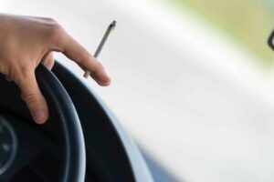Someone driving while holding marijuana