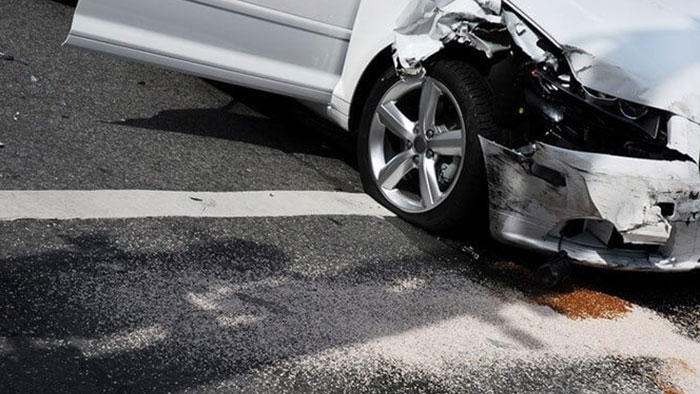 Car with front end smashed after a car accident