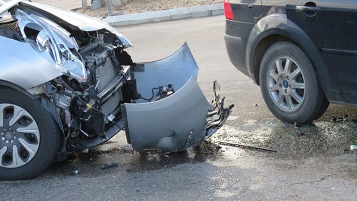 a vehicle with a smashed front end after a car accident