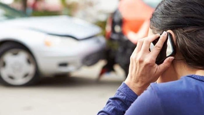 Victim calling insurance after a rear-end collision