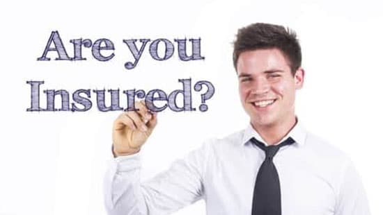 man writing "are you insured?"