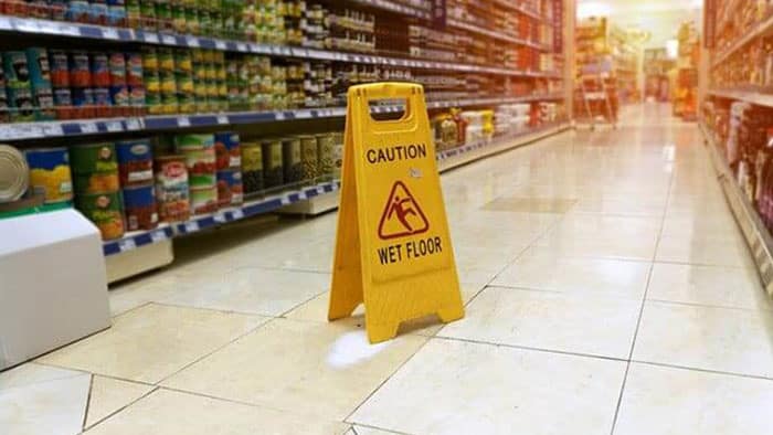 Wet floor sign in grocery store
