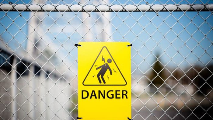 electrical danger sign on a fence