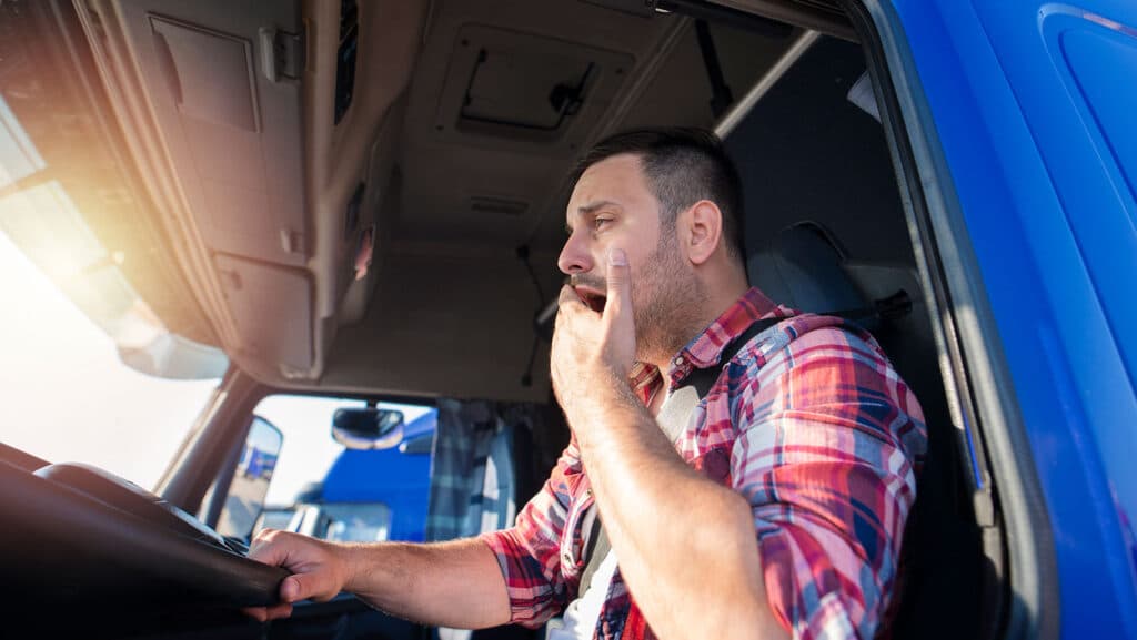 man fatigued while driving semi truck