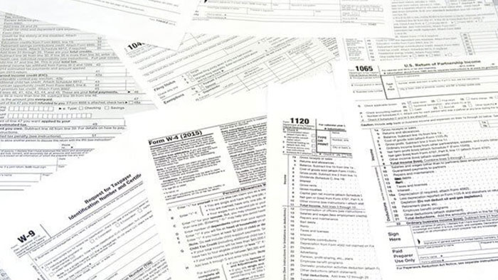 Scattered blank tax forms.