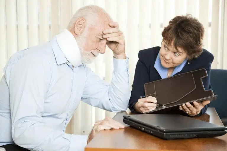 Determining Fault In A Slip-And-Fall Case 1 Victim meeting with slip and fall lawyer to determine fault