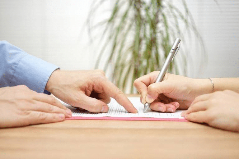 slip and fall lawyer going over paper work with a victim