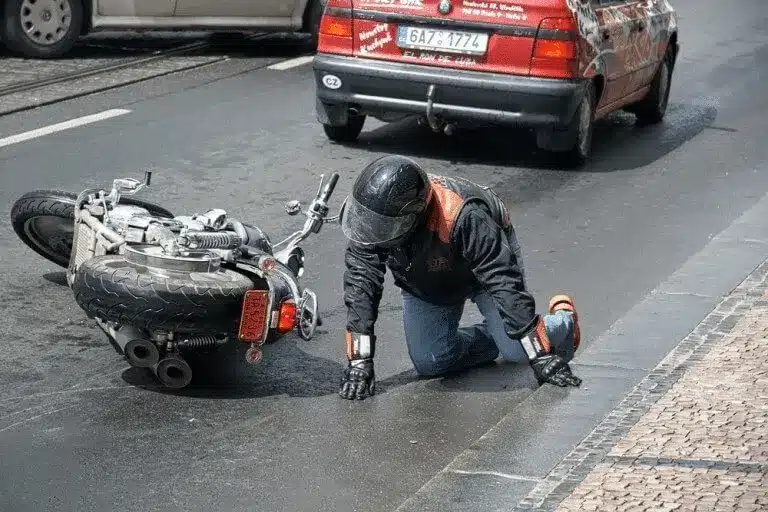 Biker fallen off his bike after a motorcycle accident