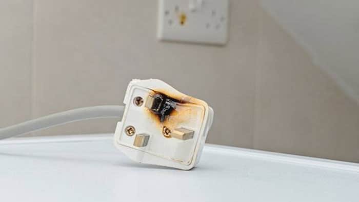 A photo of a burned electrical plug.