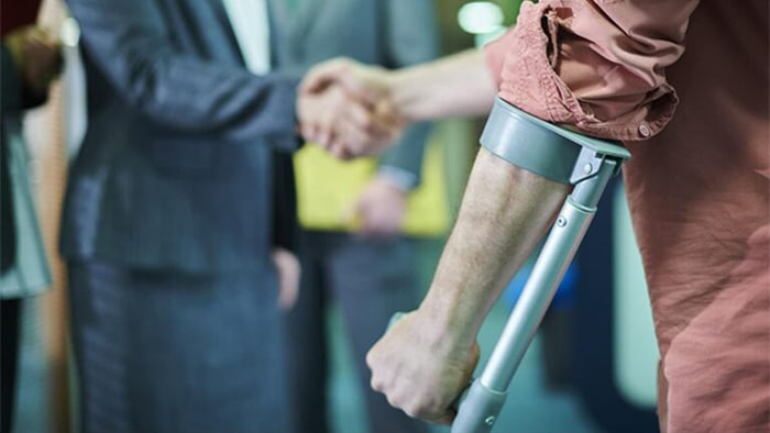 personal injury lawyer shaking clients hand
