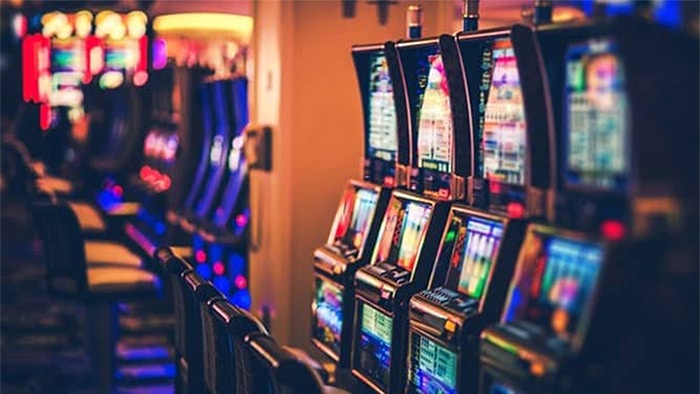 A line of slot machines at a casino.