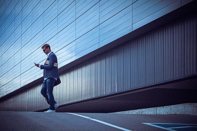 man-walking-distracted-crosses-the-street-opt