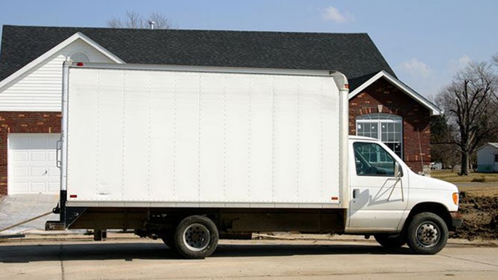 A photo of a white moving truck.