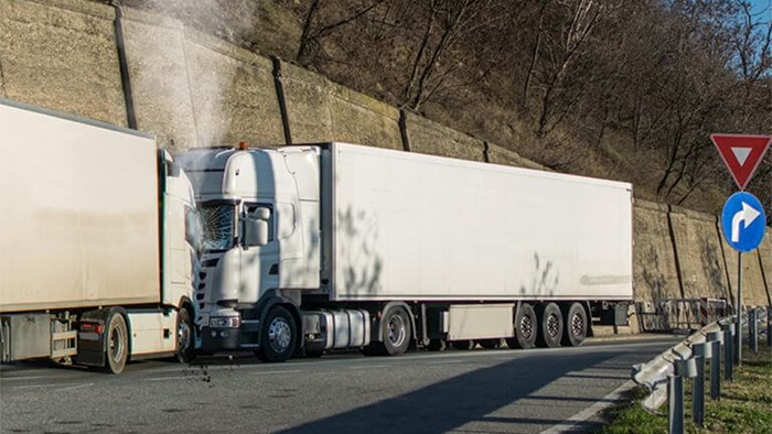 Two semi-trucks that hit head-on.