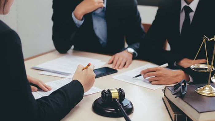 personal injury lawyers sitting around a table