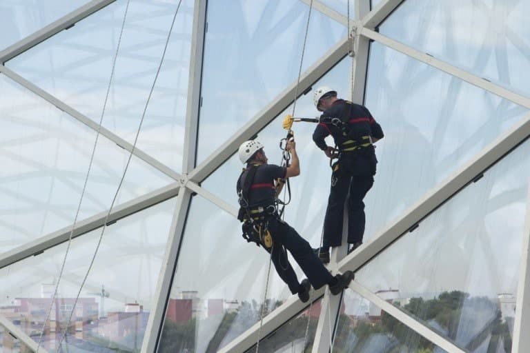 When Is A Business Required To Cover Workers’ Compensation For Their Employees? 1 Safety-workers-hanging-from-building-768x512