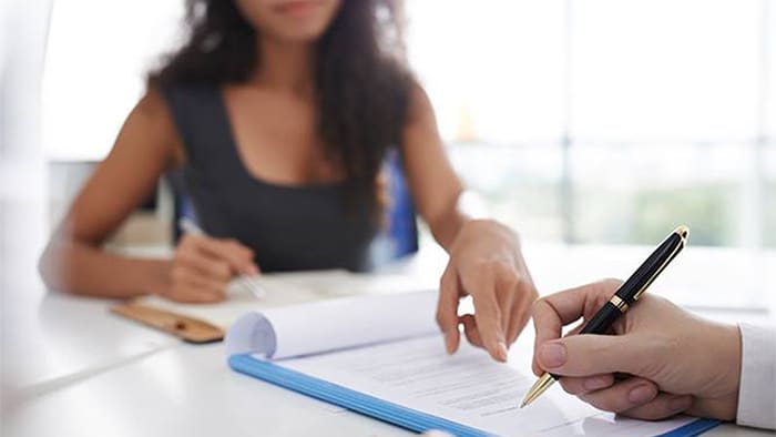 Personal injury lawyer and client settling dispute out of court