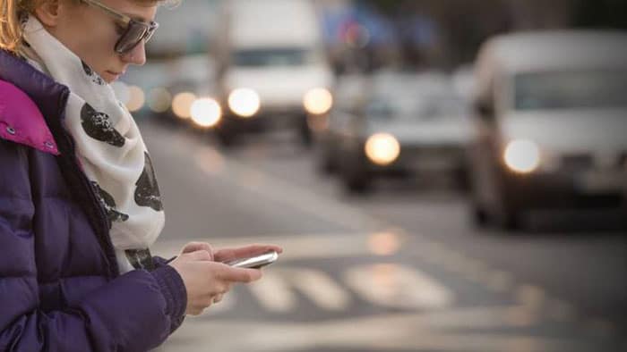 lady texting while walking