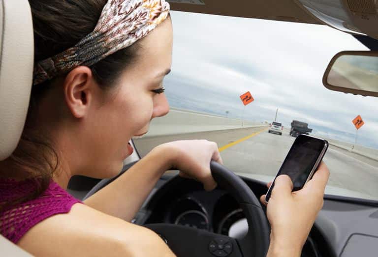 woman-texting-while-driving-768x523