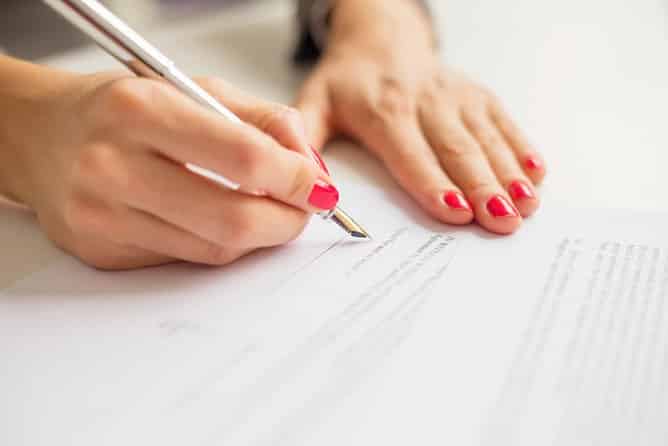woman-writing-personal-injury-demand-letter