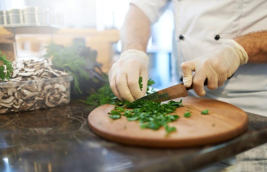 Chef chopping up cilantro