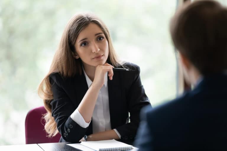Nevada Auto Accident Legal Process 2 A female personal injury lawyer listening to her client about their auto accident case.