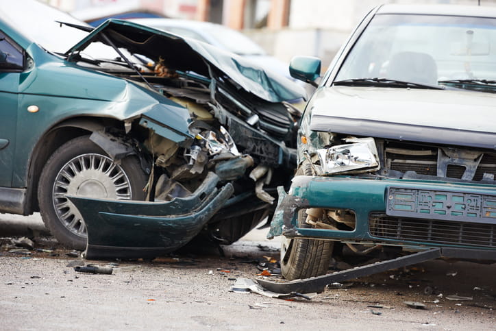 A severely damaged vehicle after colliding with a second car. 