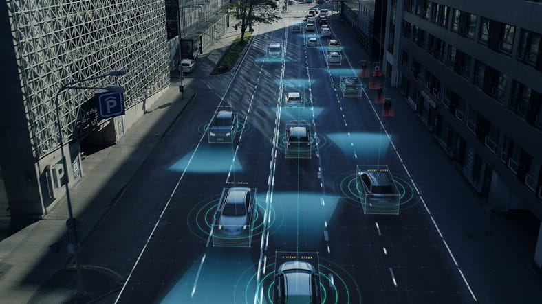 A graphic showing cars on a roadway using AI technology to scan their environment showing how self-driving cars will work.