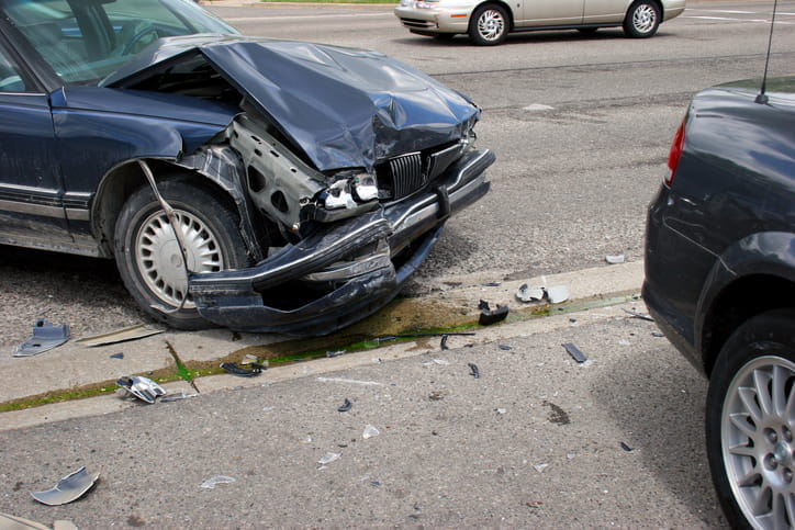A severely damaged front end of a vehicle after a car accident.
