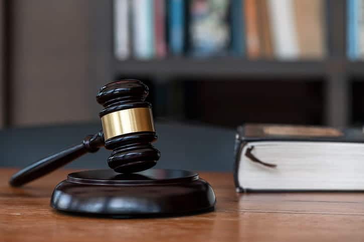 A gavel and a book on a personal injury attorney's desk. 