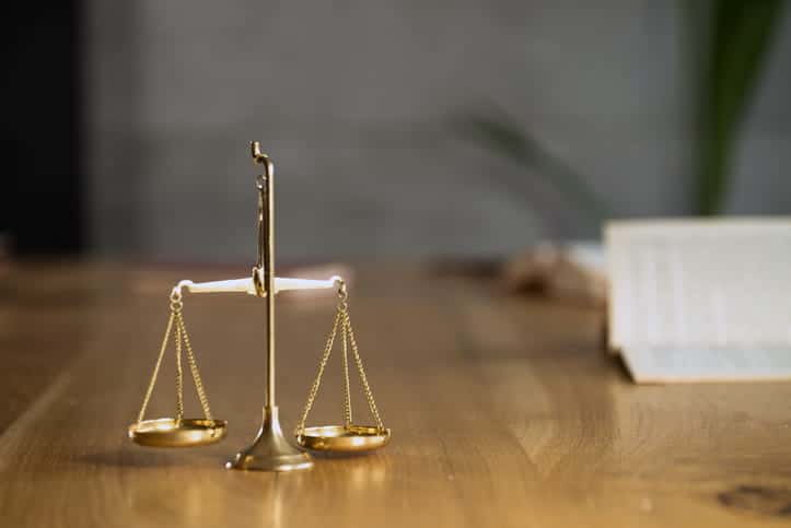 The scales of justice on a Social Security disability attorney's desk. 