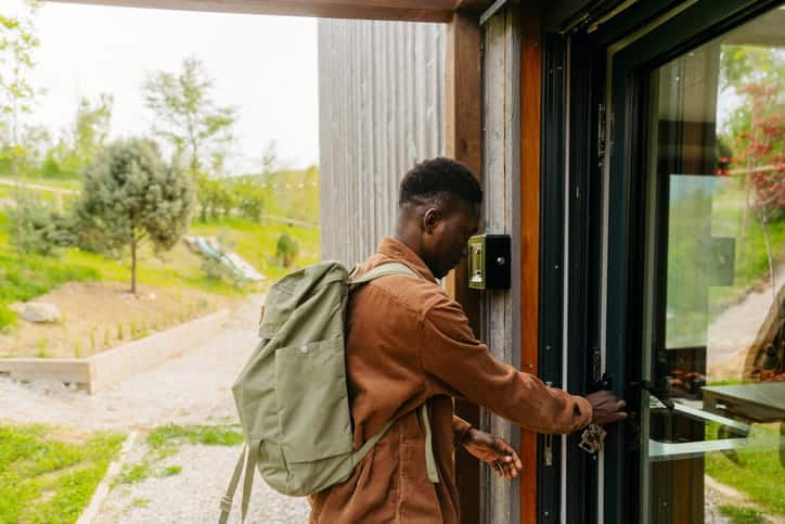 A man checking into an Airbnb.