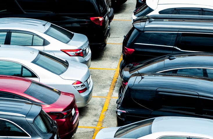 A parking lot full of vehicles. 