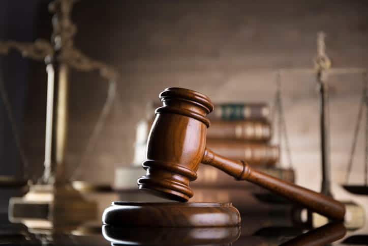 How Often Do Auto Accident Settlements Exceed The Policy Limits? 2 A gavel on a personal injury attorney's desk.