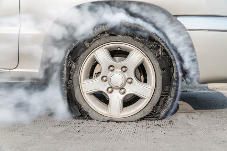 Exploding Tires: Who’s Liable? 1 An up-close view of a smoking tire after it exploded.