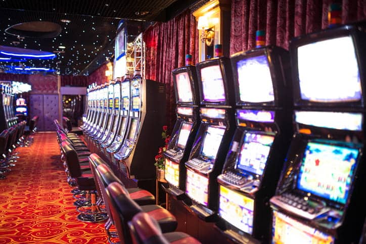 A row of empty slot machines at a casino.