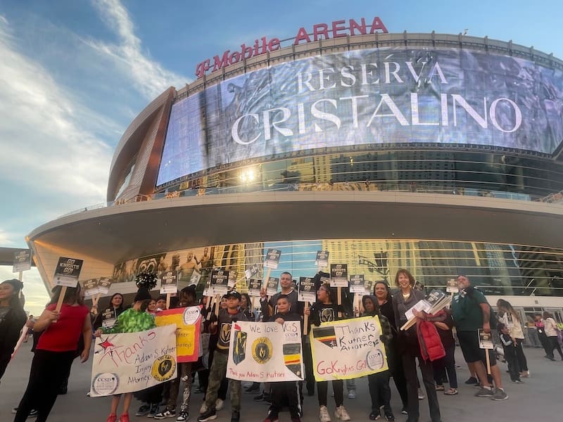 Students outside of t-mobile arena thanking adam s. Kutner attorneys.