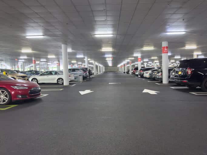 Cars parked inside a parking garage.