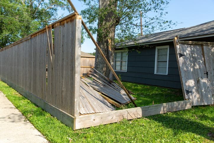 A damaged fence on private property.