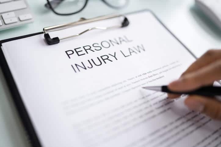 Seven Hills 12 A clipboard with a form reading "personal injury law. "