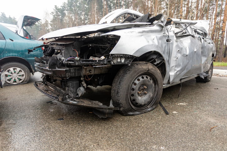 A severely damaged vehicle after a car accident.