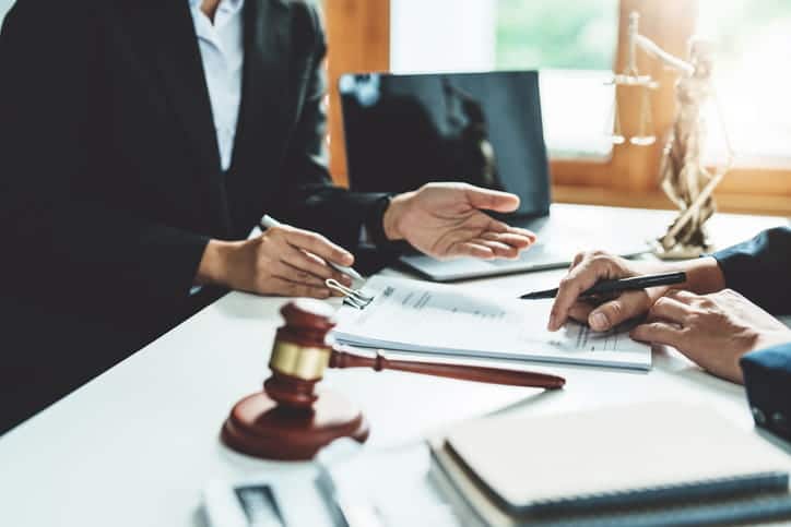 A personal injury attorney is discussing a case with a client.