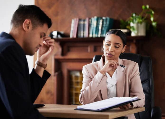 Argents Hill Personal Injury Lawyer 1 A lawyer talking to her client about his personal injury case.