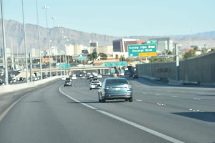 Las Vegas Traffic Fatalities Surge During The 100 Deadliest Days Of Summer: What You Need To Know 1 Cars driving on a highway near las vegas during the summer.