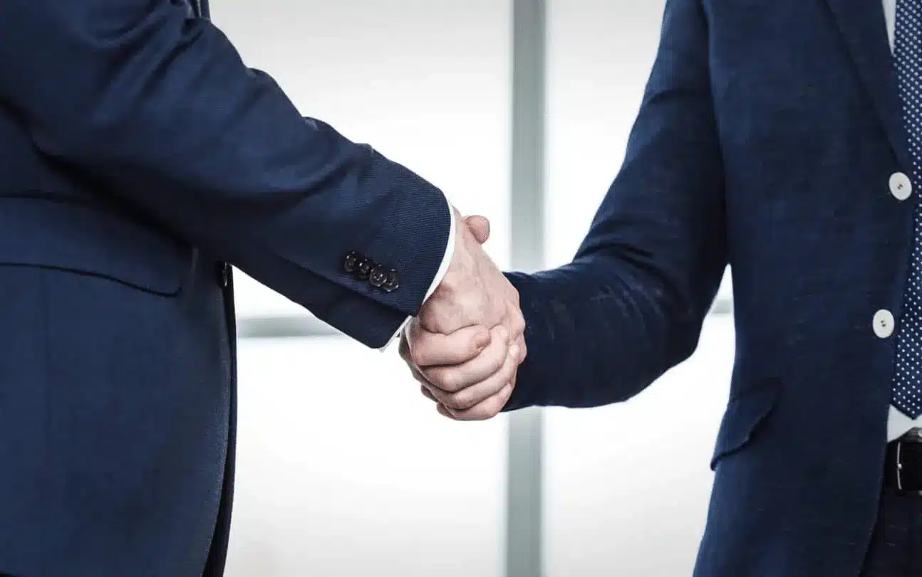 Las vegas personal injury lawyers shaking hands with client at adam s. Kutner & associates, injury attorneys.