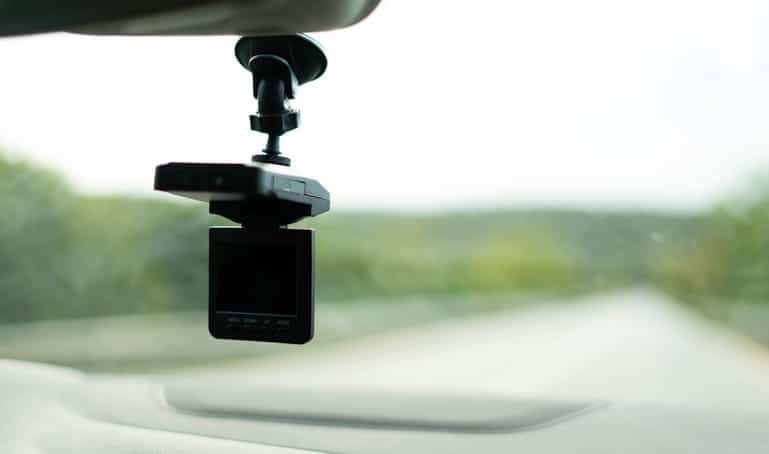 A dashcam set up in a person's vehicle.