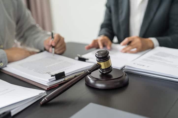 Why Witnesses Are Crucial In Nevada Personal Injury Cases 1 A personal injury lawyer is speaking with an accident witness for a personal injury case.