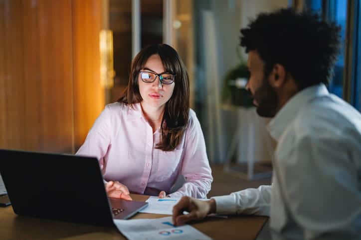 A lawyer reviewing a personal injury case with her client.