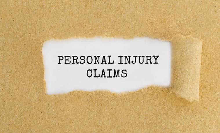 A torn piece of paper that reads "personal injury claims. "