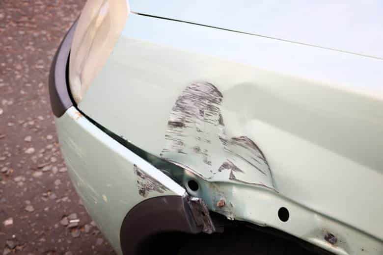 Damage to a vehicle after a minor car accident.